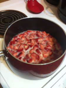 strawberries and honey in pot