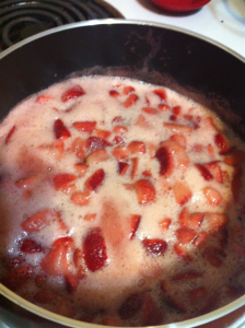 strawberries in a frothing pink liquid